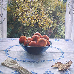 Still life with oranges on blue dish and autumn trees 