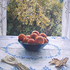 Still life with oranges on blue dish and autumn trees